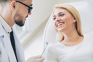 Image of a young woman smiling before her oral cancer screening at Brian K. Rounds, DDS in Lacey.